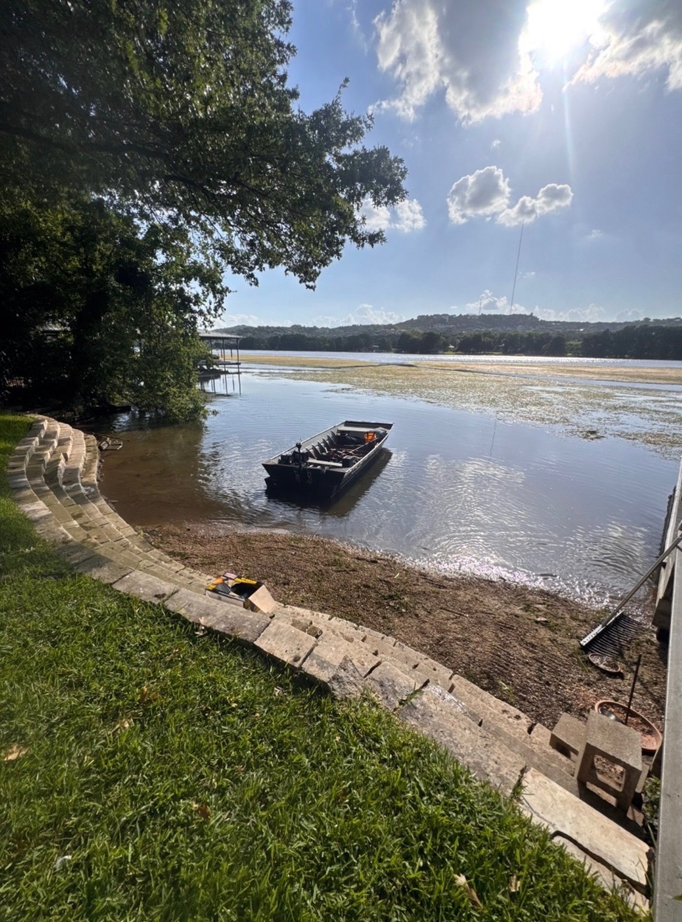 Cleared Lake Austin shoreline after hydrilla removal with jon boat